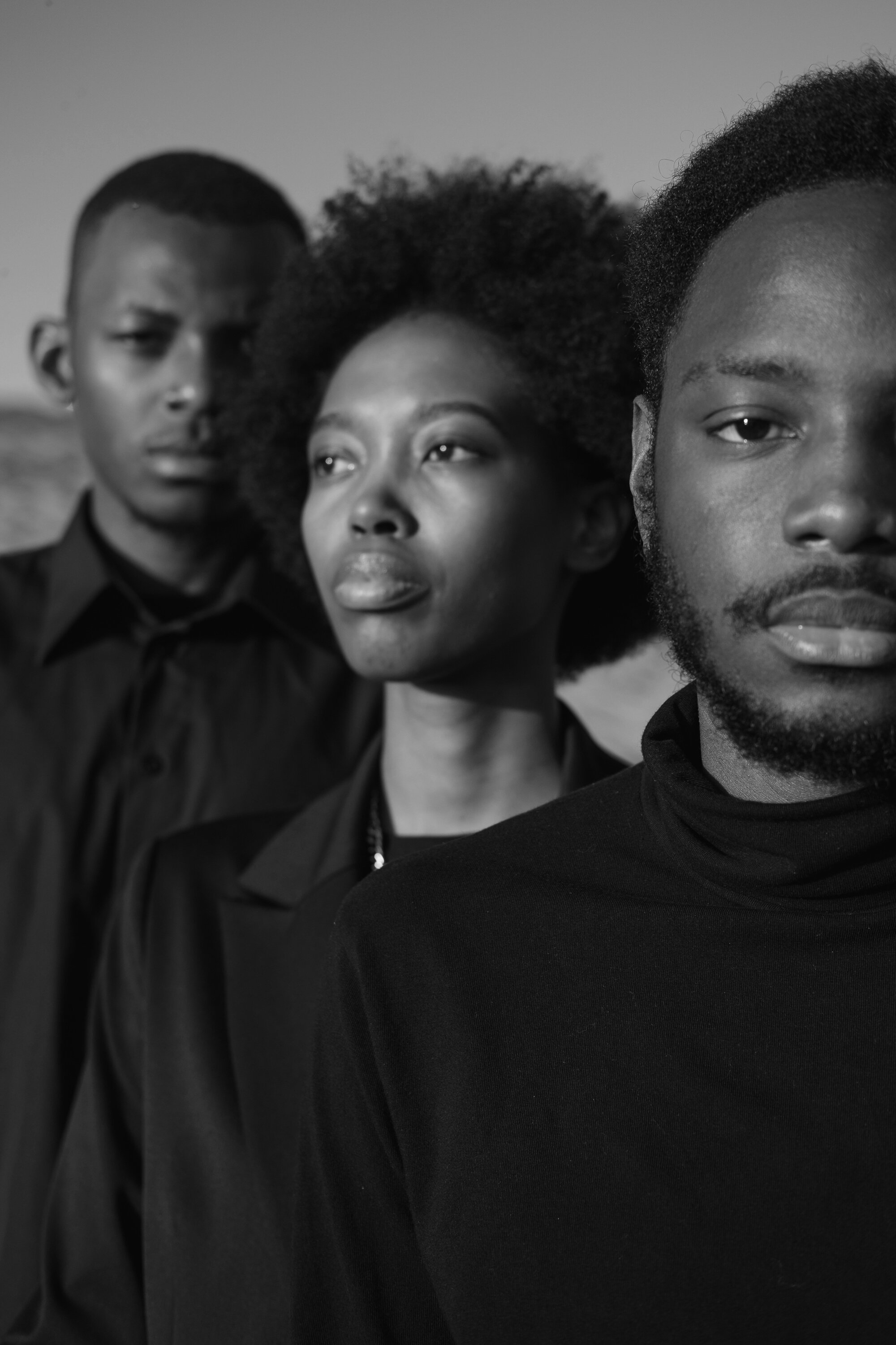 Three Diverse People in Black Outfit Outdoors